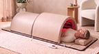 Woman relaxing in The Restore Dome™ with her head resting on the cushion outside the dome