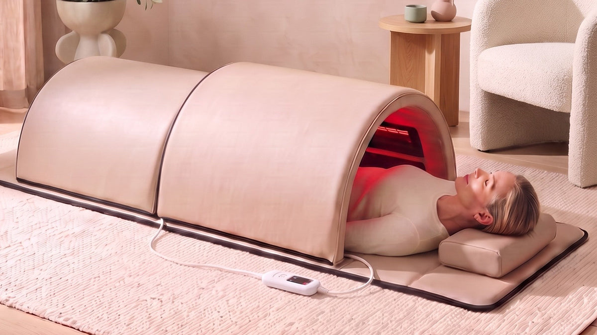 The Restore Dome™ with a woman resting inside, head on the cushion outside the dome